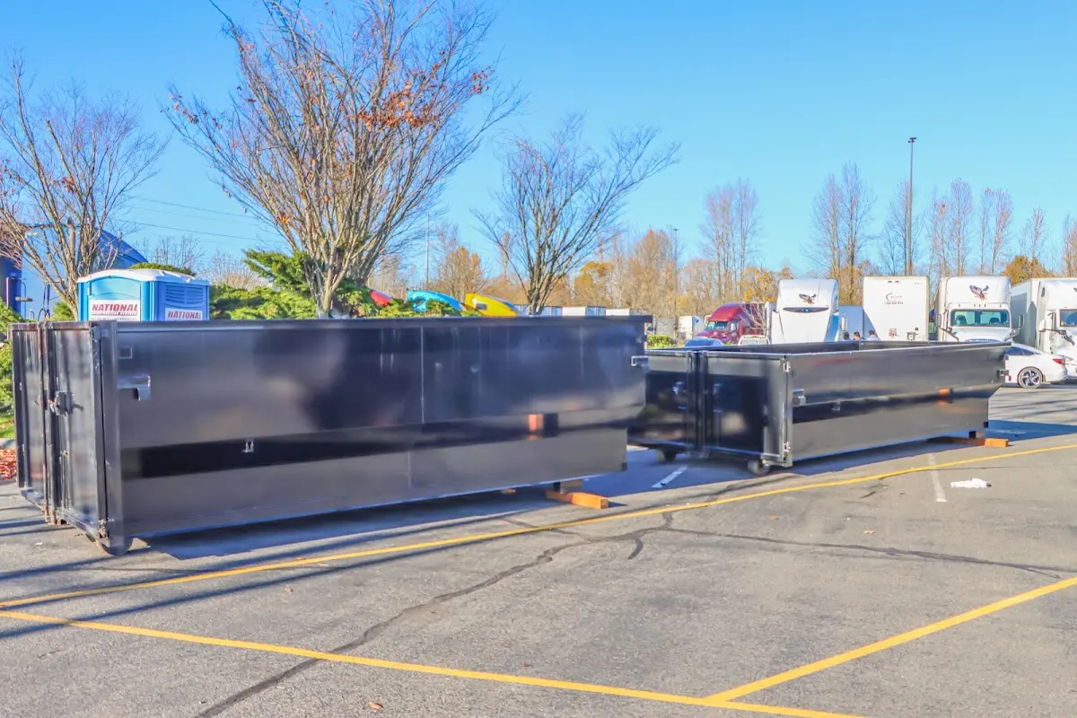 Professional dumpster rental service with roll-off container on residential driveway in Warrensville Heights